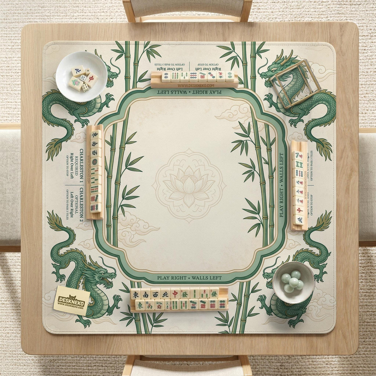 Sage green mahjong mat with a bamboo pattern, dragon design, printed rules around the edge, and a scalloped edge option.