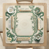 Sage green mahjong mat with a bamboo pattern, dragon design, printed rules around the edge, and a scalloped edge option.