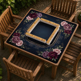 Burgundy mahjong mat with a floral border, gold botanical details, and printed American Mahjong rules on a dark background.