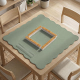 A square sage green mahjong mat with scalloped edges on a plain background.