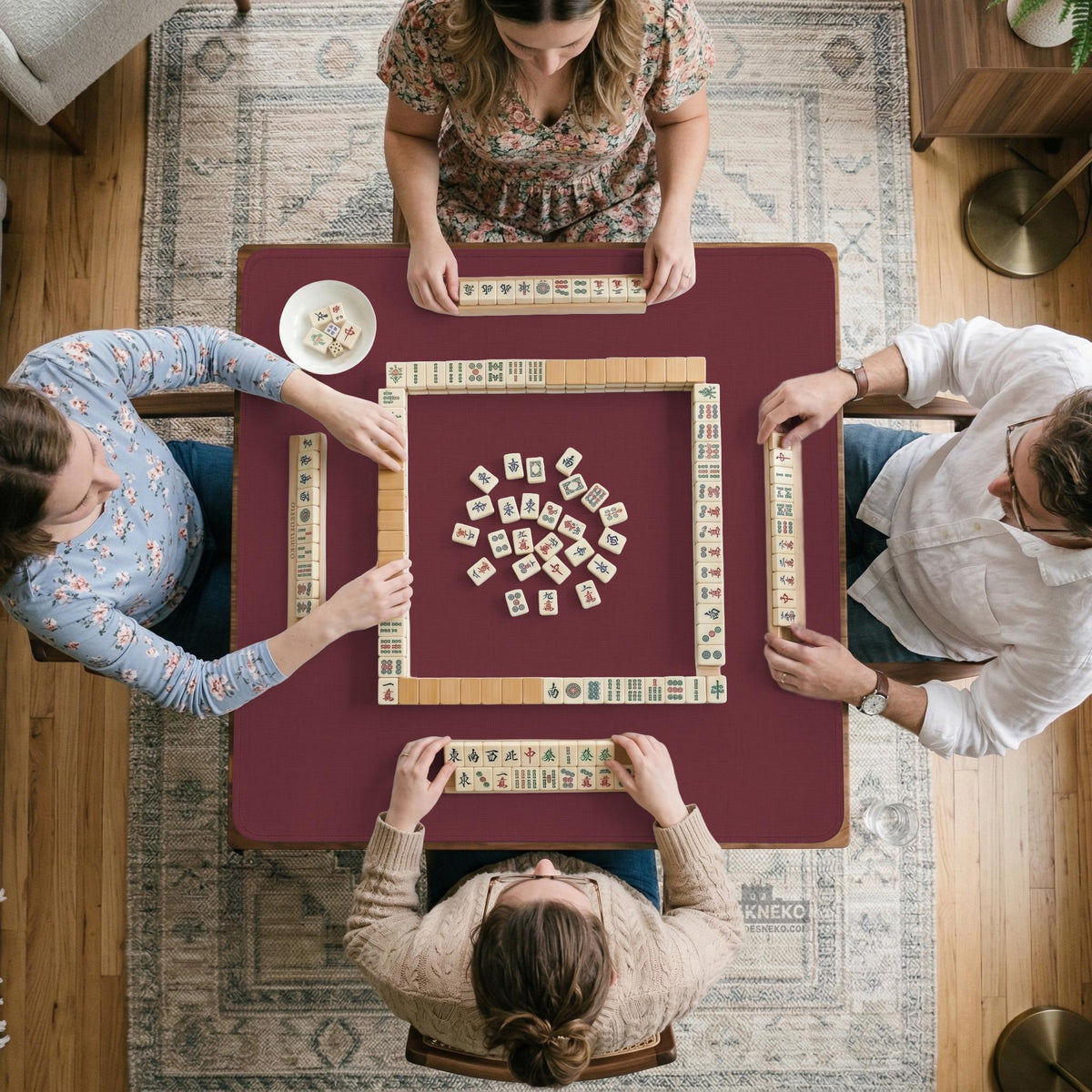 Plain burgundy square mahjong mat with scalloped edges on a white background.
