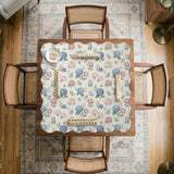 Pink floral mahjong table mat with peonies, blue hydrangeas, sage green leaves, and an ivory background.