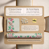 Pink cherry blossom floral mahjong table mat with a cream center and bamboo-style border design.