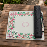 Pink cherry blossom floral mahjong table mat with a cream center and bamboo-style border design.