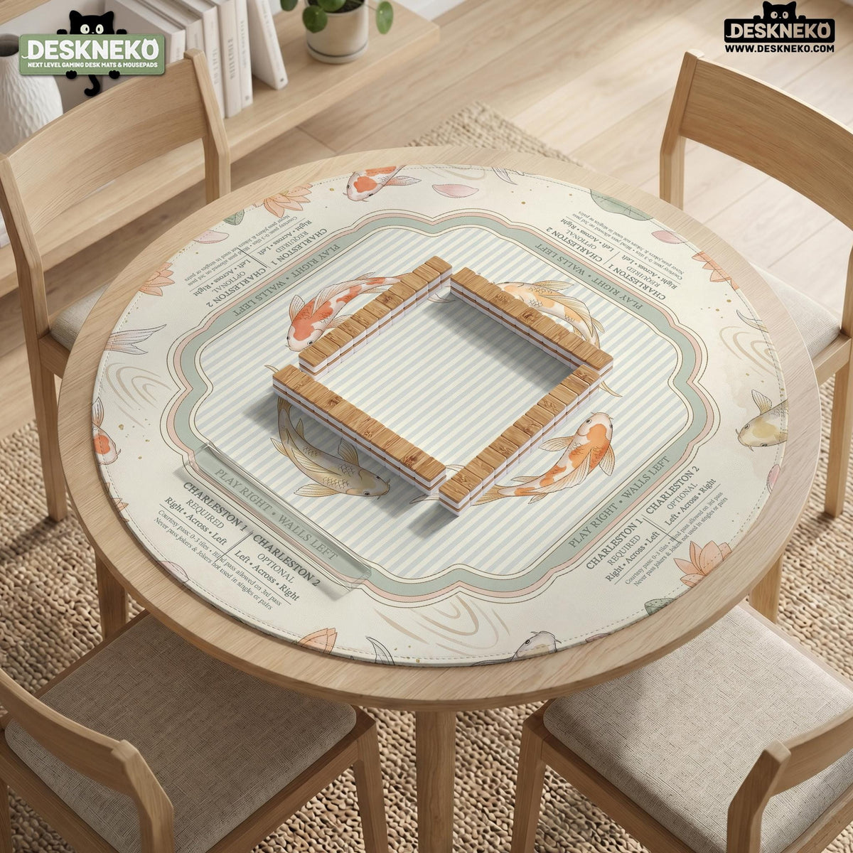 Sage and cream mahjong mat with a koi fish pond pattern, lotus blooms, water ripples, and printed instructions around the border. One version has a scalloped edge.