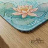 Pastel aqua square mahjong mat with orange koi fish, lotus flowers, lily pads, and flowing water lines.