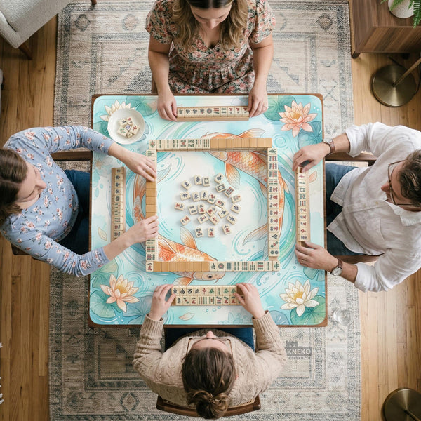 Pastel aqua square mahjong mat with orange koi fish, lotus flowers, lily pads, and flowing water lines.