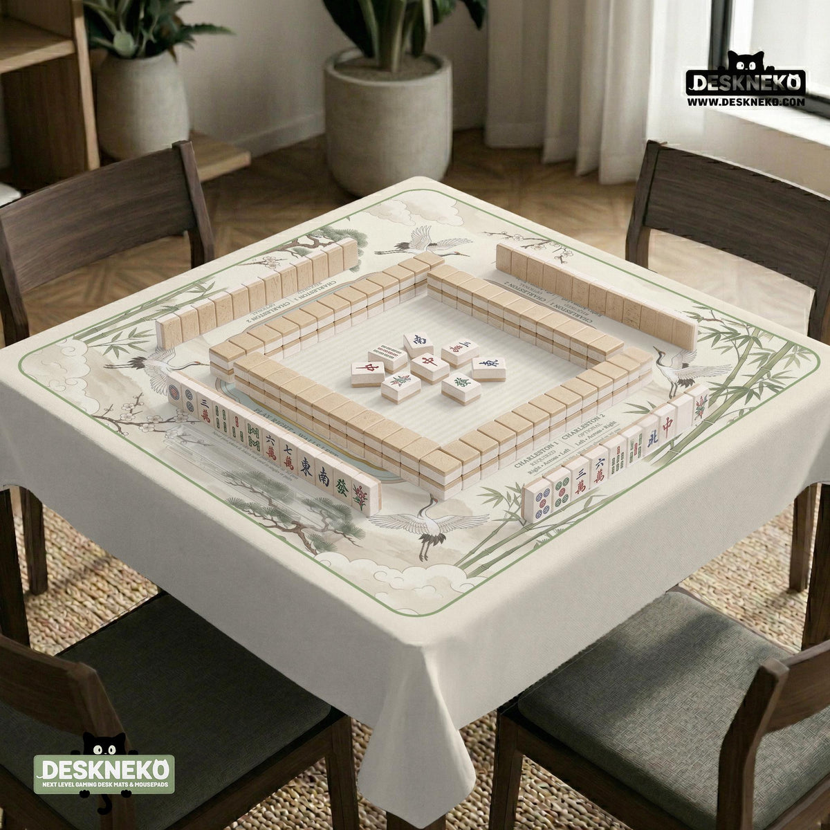 Sage green scalloped mahjong mat with bamboo, crane, and blossom illustration and printed rules around the border.