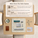 Cream mahjong mat with a floral pattern of small wildflowers and sage leaves, shown with a scalloped edge on a light neutral background.