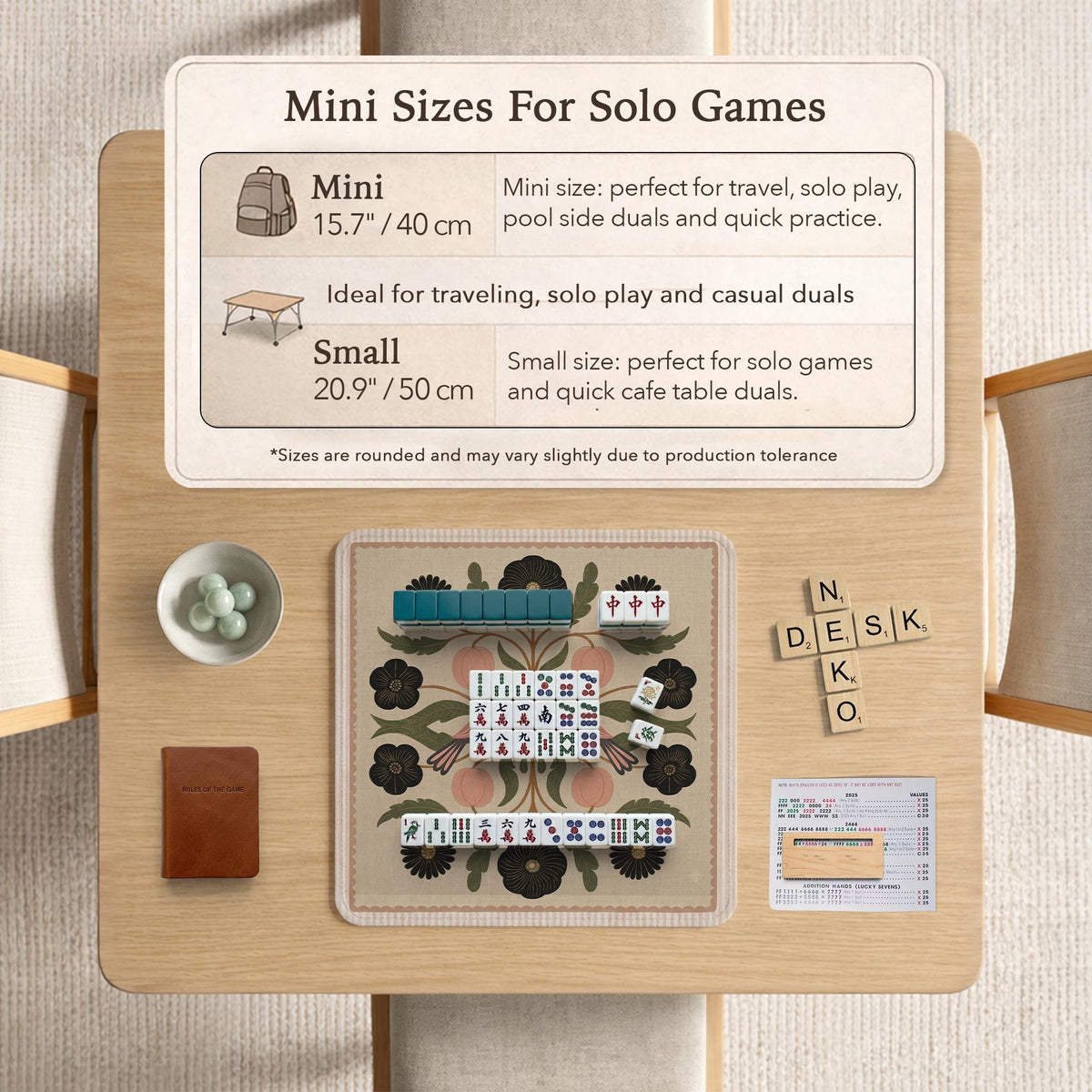 Beige mahjong mat with a botanical floral bird design, blush flowers, olive green leaves, black flower accents, and a warm linen-style background. Scalloped edge option shown.