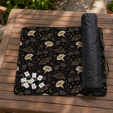 Black square mahjong mat with moths, moonflowers, crescent moons, and scattered stars in a celestial floral pattern.