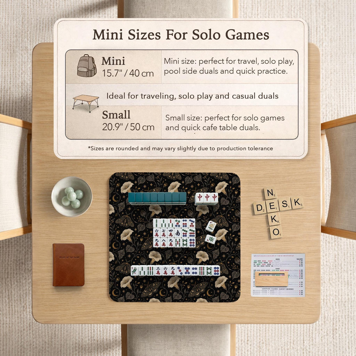 Black square mahjong mat with moths, moonflowers, crescent moons, and scattered stars in a celestial floral pattern.