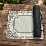 Square mahjong mat with a cream background, blue birds, sage leaves, terracotta flowers, and a decorative botanical border with printed rules text.