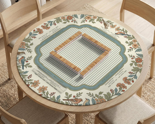 Square mahjong mat with a cream background, blue birds, sage leaves, terracotta flowers, and a decorative botanical border with printed rules text.