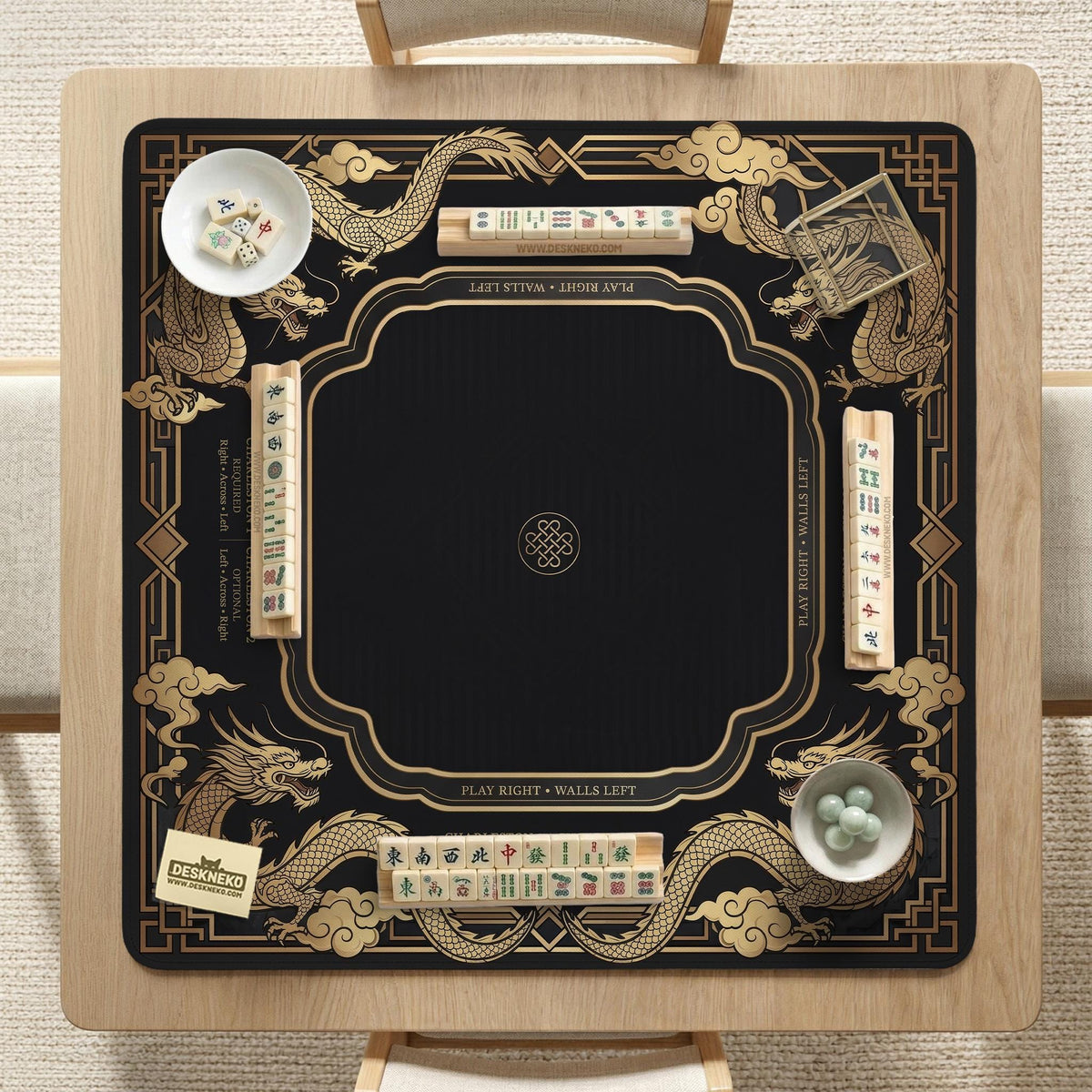 Black mahjong mat with gold dragon artwork, a scalloped edge, and printed Mahjong rules on the surface.