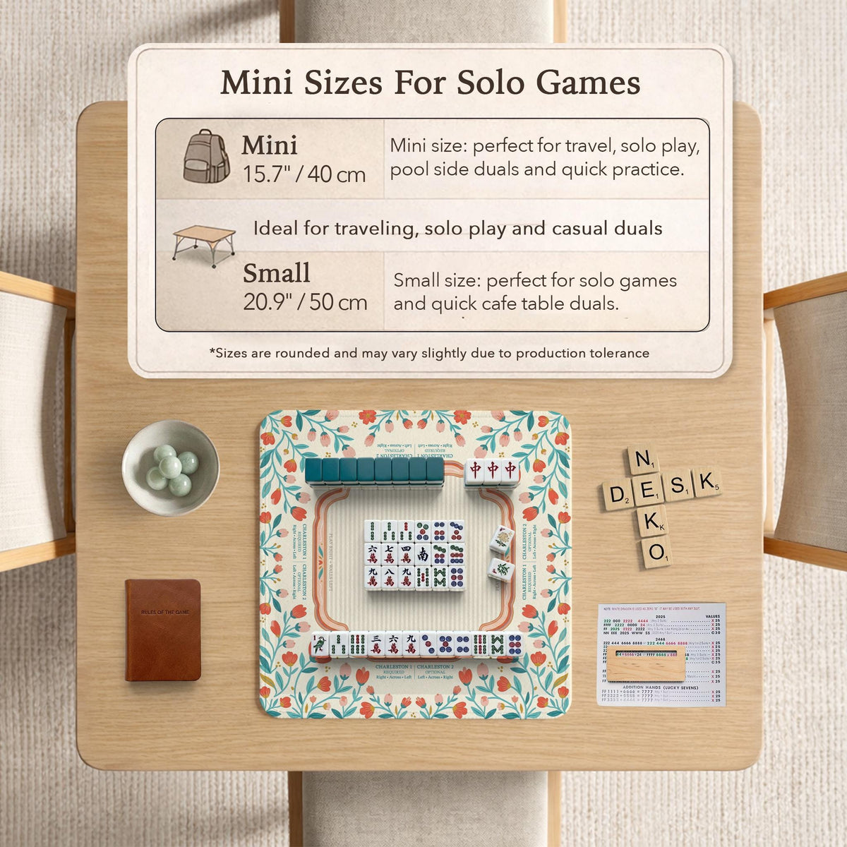 Cream mahjong mat with a coral and teal floral border, rule layout text, Charleston guide notes, and a blank center area for tile play.