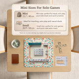 Cream mahjong mat with a coral and teal floral border, rule layout text, Charleston guide notes, and a blank center area for tile play.