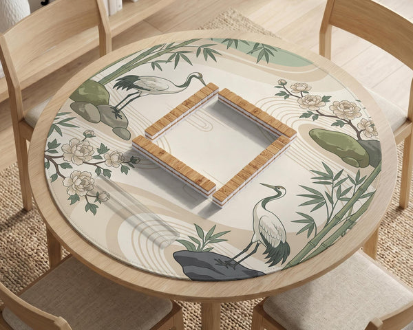 Square mahjong mat with a cream background, sage green cranes, bamboo leaves, peony branches, stones, and thin linework.