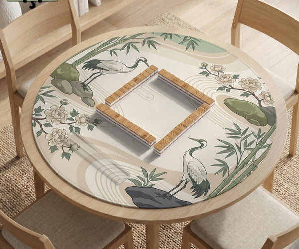 Square mahjong mat with a cream background, sage green cranes, bamboo leaves, peony branches, stones, and thin linework.