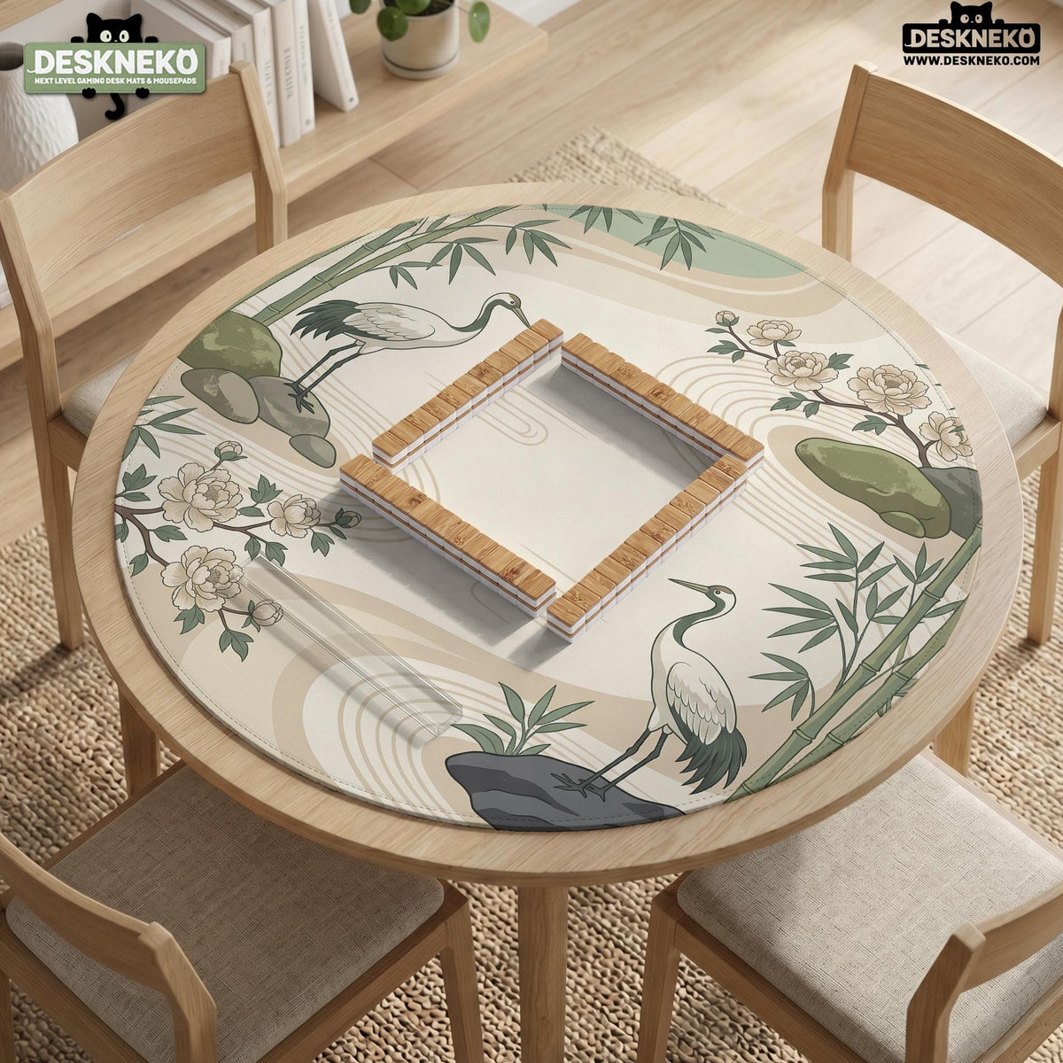 Square mahjong mat with a cream background, sage green cranes, bamboo leaves, peony branches, stones, and thin linework.