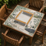Square mahjong mat with a cream background, sage green cranes, bamboo leaves, peony branches, stones, and thin linework.