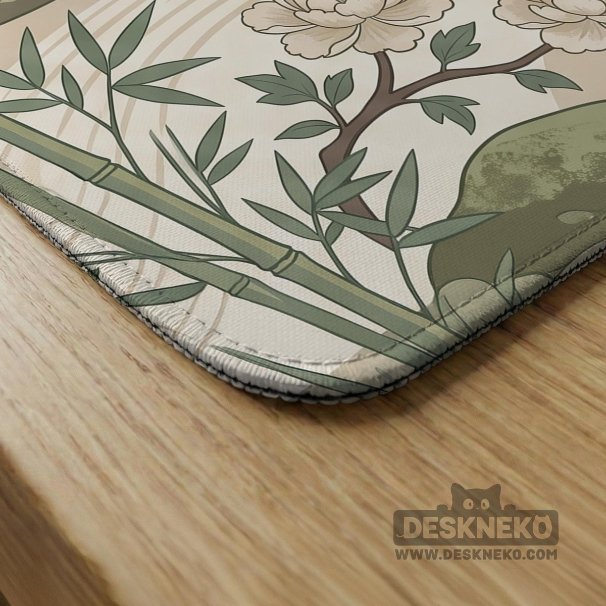 Square mahjong mat with a cream background, sage green cranes, bamboo leaves, peony branches, stones, and thin linework.