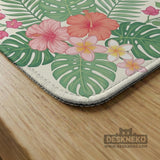 Coral tropical floral mahjong mat with hibiscus flowers, palm leaves, cream sections, and a scalloped edge.
