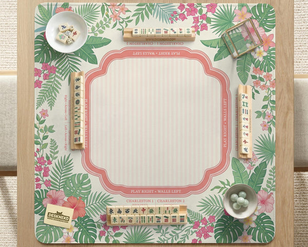 Coral tropical floral mahjong mat with hibiscus flowers, palm leaves, cream sections, and a scalloped edge.