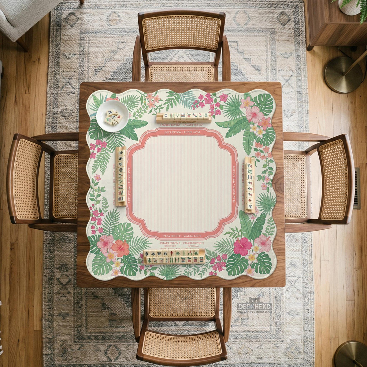 Coral tropical floral mahjong mat with hibiscus flowers, palm leaves, cream sections, and a scalloped edge.