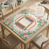 Coral tropical floral mahjong mat with hibiscus flowers, palm leaves, cream sections, and a scalloped edge.
