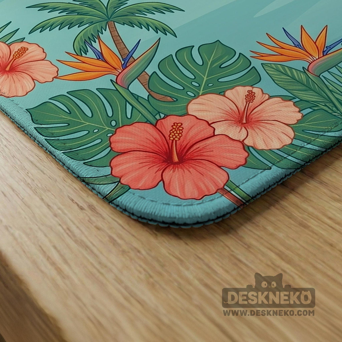 Pink mahjong mat with flamingos, palm leaves, hibiscus flowers, and aqua tropical background.