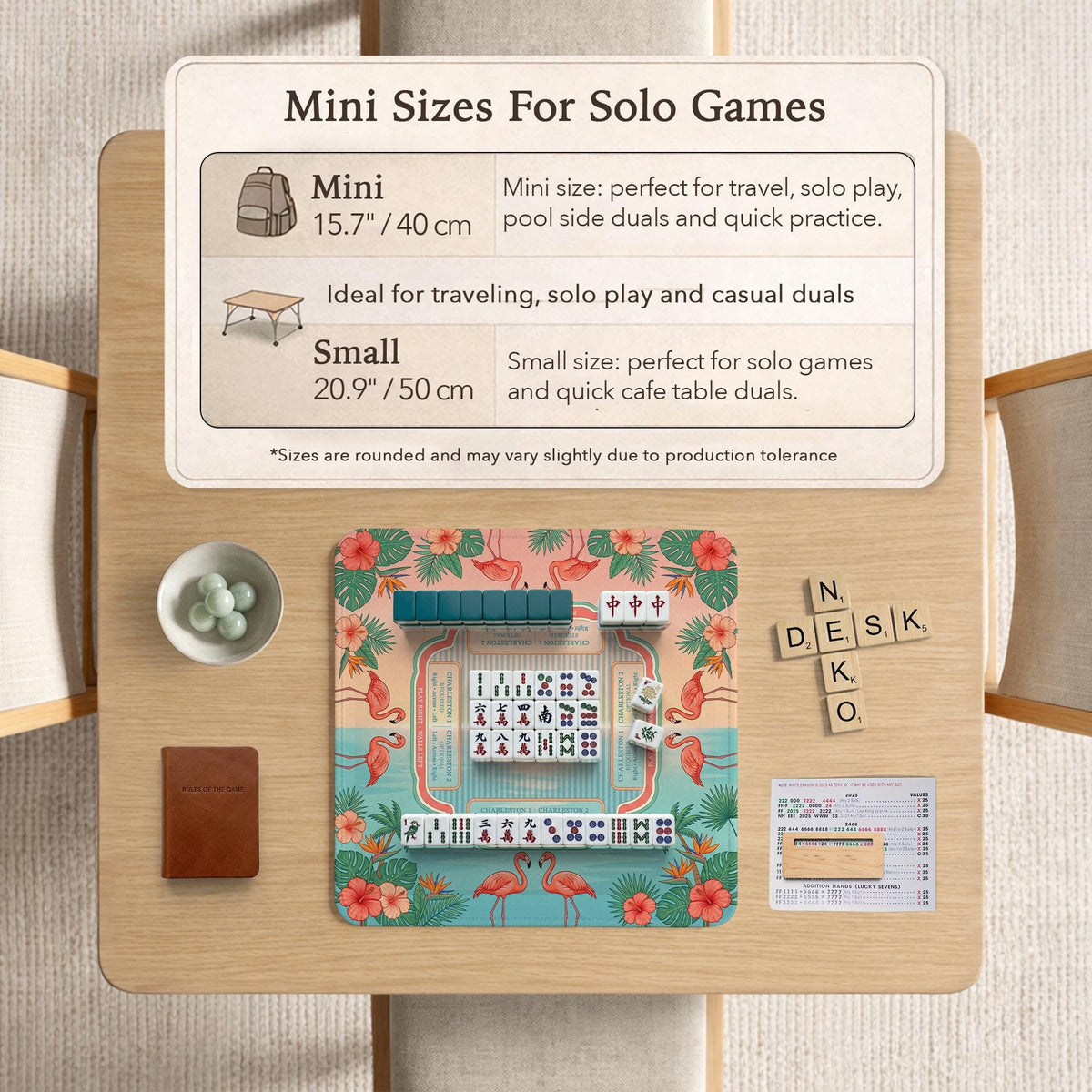Pink mahjong mat with flamingos, palm leaves, hibiscus flowers, and aqua tropical background.
