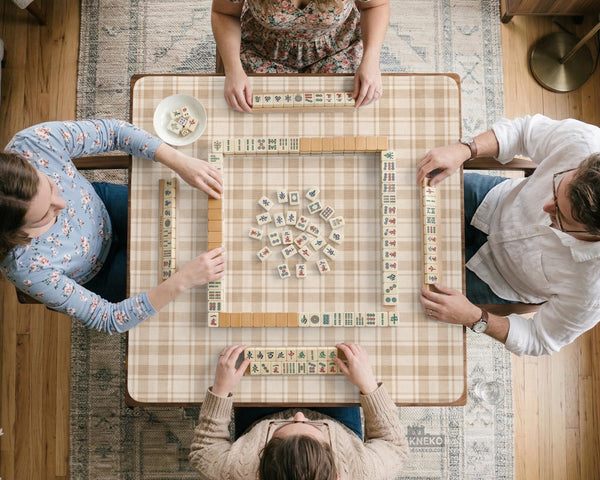 Beige plaid mahjong mat with a cream tartan pattern on a neutral background.