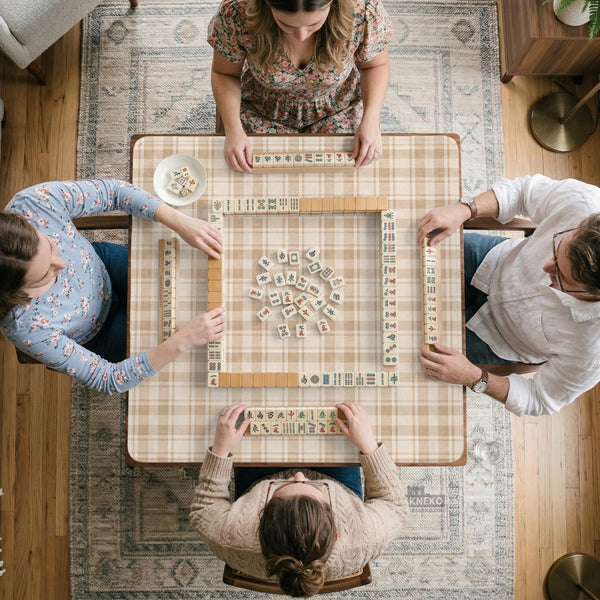 Beige plaid mahjong mat with a cream tartan pattern on a neutral background.