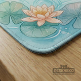 A soft blue mahjong mat with koi fish, floating lily pads, pale floral details, and a watercolor-style pond design.