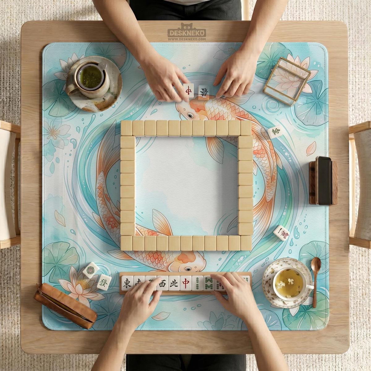 A soft blue mahjong mat with koi fish, floating lily pads, pale floral details, and a watercolor-style pond design.