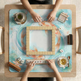 A soft blue mahjong mat with koi fish, floating lily pads, pale floral details, and a watercolor-style pond design.