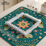 Green mahjong mat with a botanical bee and floral mandala design in teal, coral, cream, and gold.