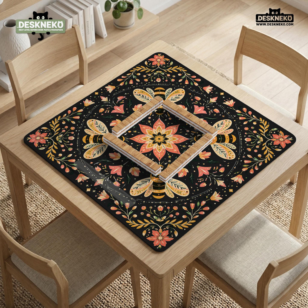 Black mahjong mat with a symmetrical botanical design, coral flowers, golden leaves, and small bees.