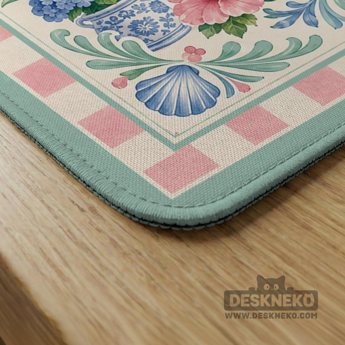 Pastel mahjong mat with a pink gingham border, seashells, hydrangea pots, palm trees, croquet details, and a coastal garden scene.