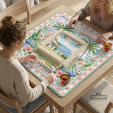 Pastel mahjong mat with a pink gingham border, seashells, hydrangea pots, palm trees, croquet details, and a coastal garden scene.