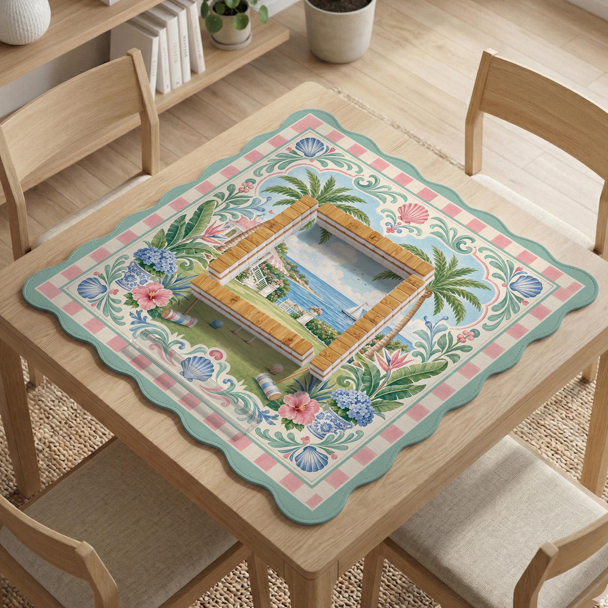 Pastel mahjong mat with a pink gingham border, seashells, hydrangea pots, palm trees, croquet details, and a coastal garden scene.
