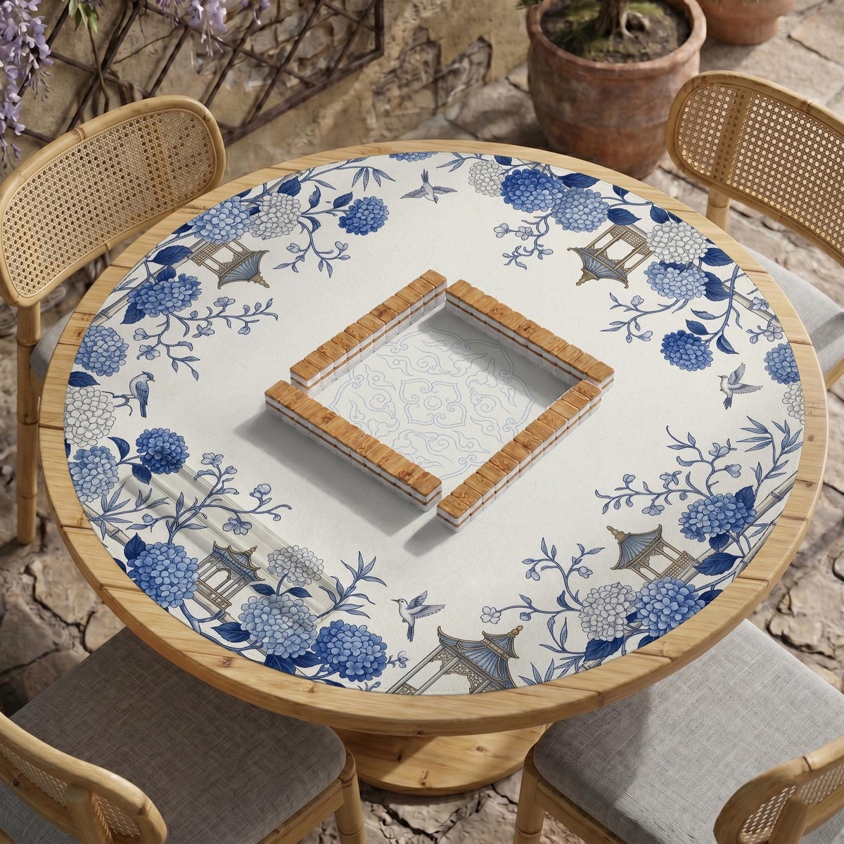 Blue and white square mahjong mat with a hydrangea and bird botanical border and a plain center area.