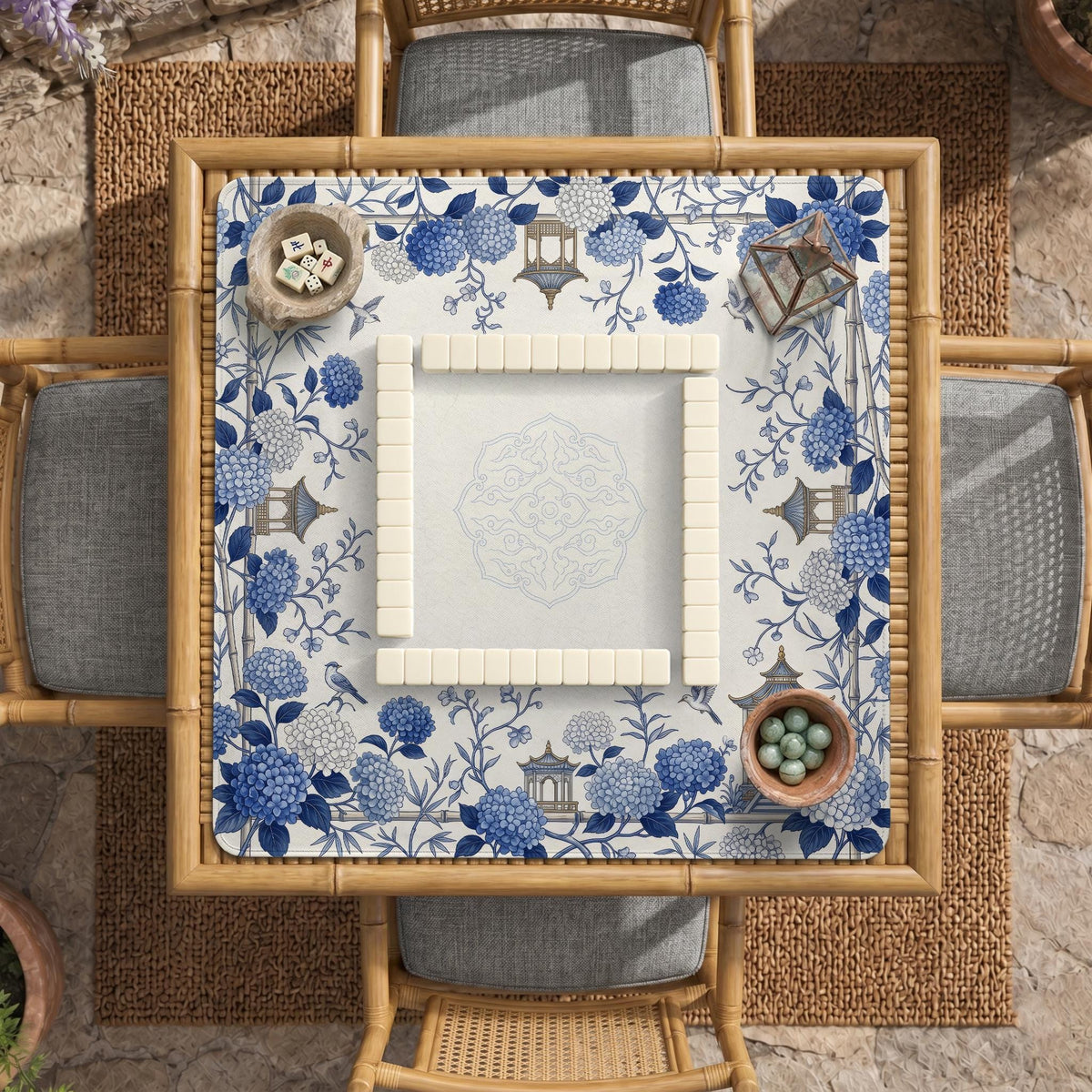 Blue and white square mahjong mat with a hydrangea and bird botanical border and a plain center area.