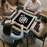 Navy square mahjong mat with a floral border, copper moons, scattered stars, pale moths, and leafy botanical details.