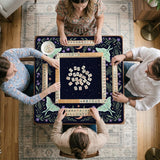 Navy square mahjong mat with a floral border, copper moons, scattered stars, pale moths, and leafy botanical details.