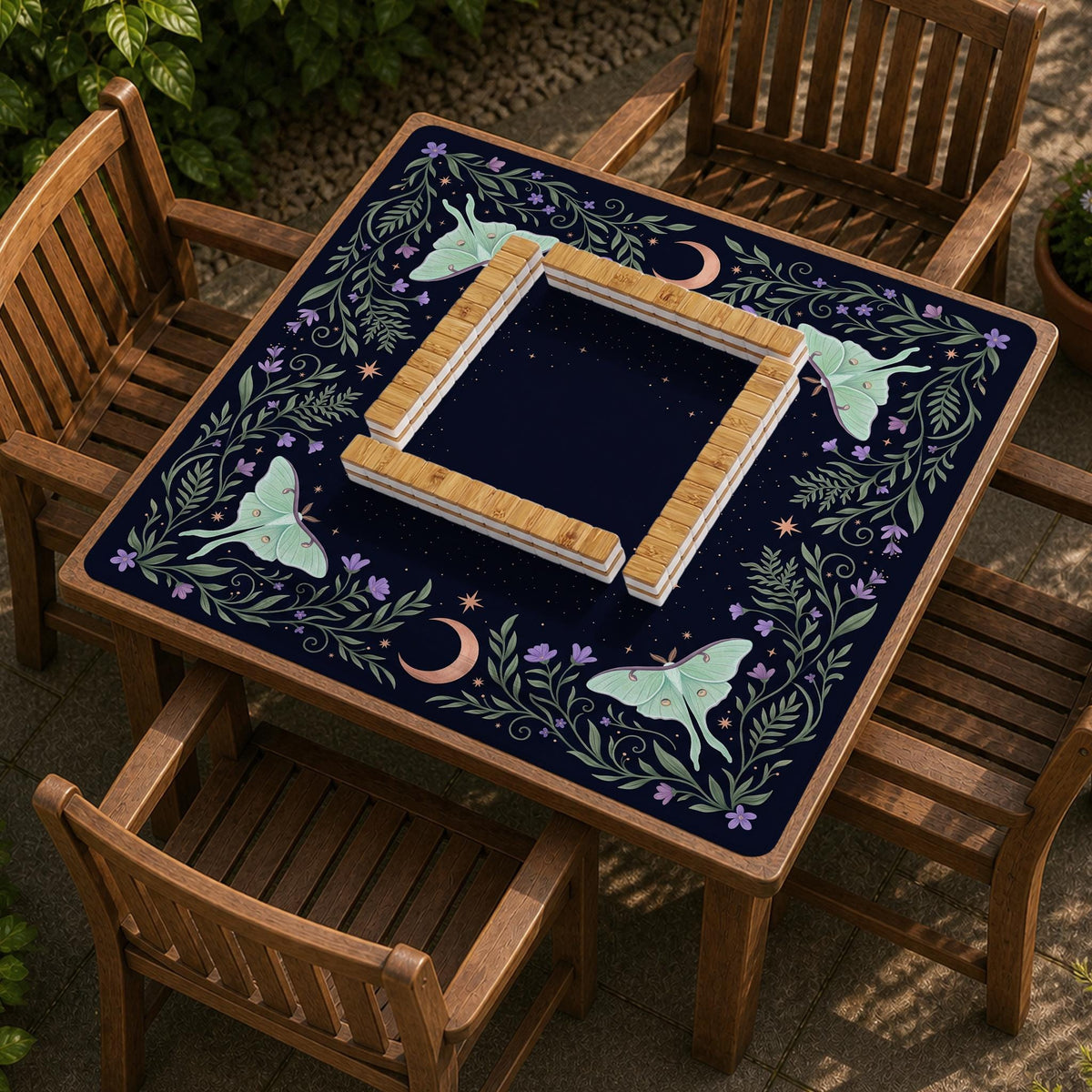 Navy square mahjong mat with a floral border, copper moons, scattered stars, pale moths, and leafy botanical details.