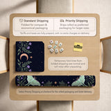Navy square mahjong mat with a floral border, copper moons, scattered stars, pale moths, and leafy botanical details.