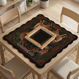 Black square mahjong mat with mirrored tiger faces, bamboo, dark tropical leaves, ornate border details, and orange accents.