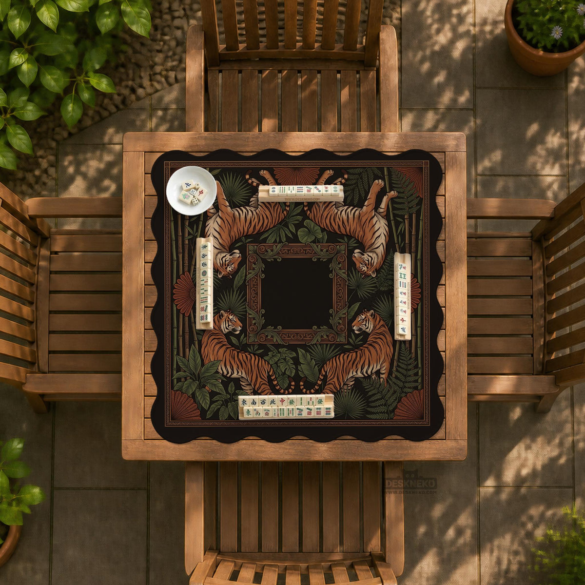 Black square mahjong mat with mirrored tiger faces, bamboo, dark tropical leaves, ornate border details, and orange accents.